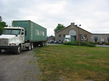 Transports getting loaded with wool from CCWG in Carleton Place